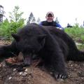 Dan with his big boar he harvested with his inline muzzleloader, a great shot