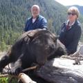 Doug and Carolyn with a 7 ft boar
