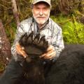 Todd with his foot of his bear that measured well over 7 ft